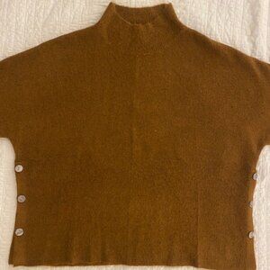 Mock neck boxy pullover poncho, short sleeved, side button detail.